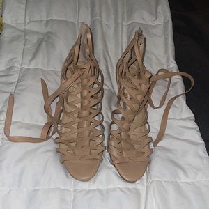 Antonio Melani zippered close with straps around the ankles